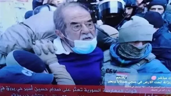 ما حقيقة الصورة المتداولة حول العثور على صدام حسين في سجن صيدنايا؟